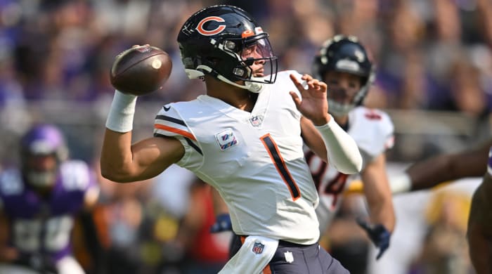 Oct 9, 2022; Minneapolis, Minnesota, USA; Chicago Bears quarterback Justin Fields (1) throws a pass against the Minnesota Vikings during the first quarter at U.S. Bank Stadium.